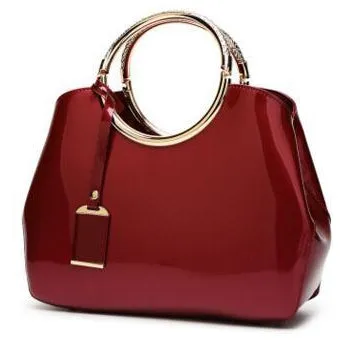 Women Shiny Glossy Faux-Leather Handbag with a Decorative Brass Buckle