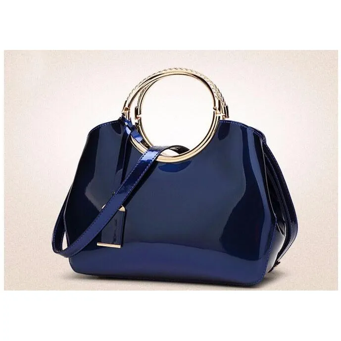 Women Shiny Glossy Faux-Leather Handbag with a Decorative Brass Buckle