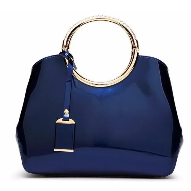 Women Shiny Glossy Faux-Leather Handbag with a Decorative Brass Buckle